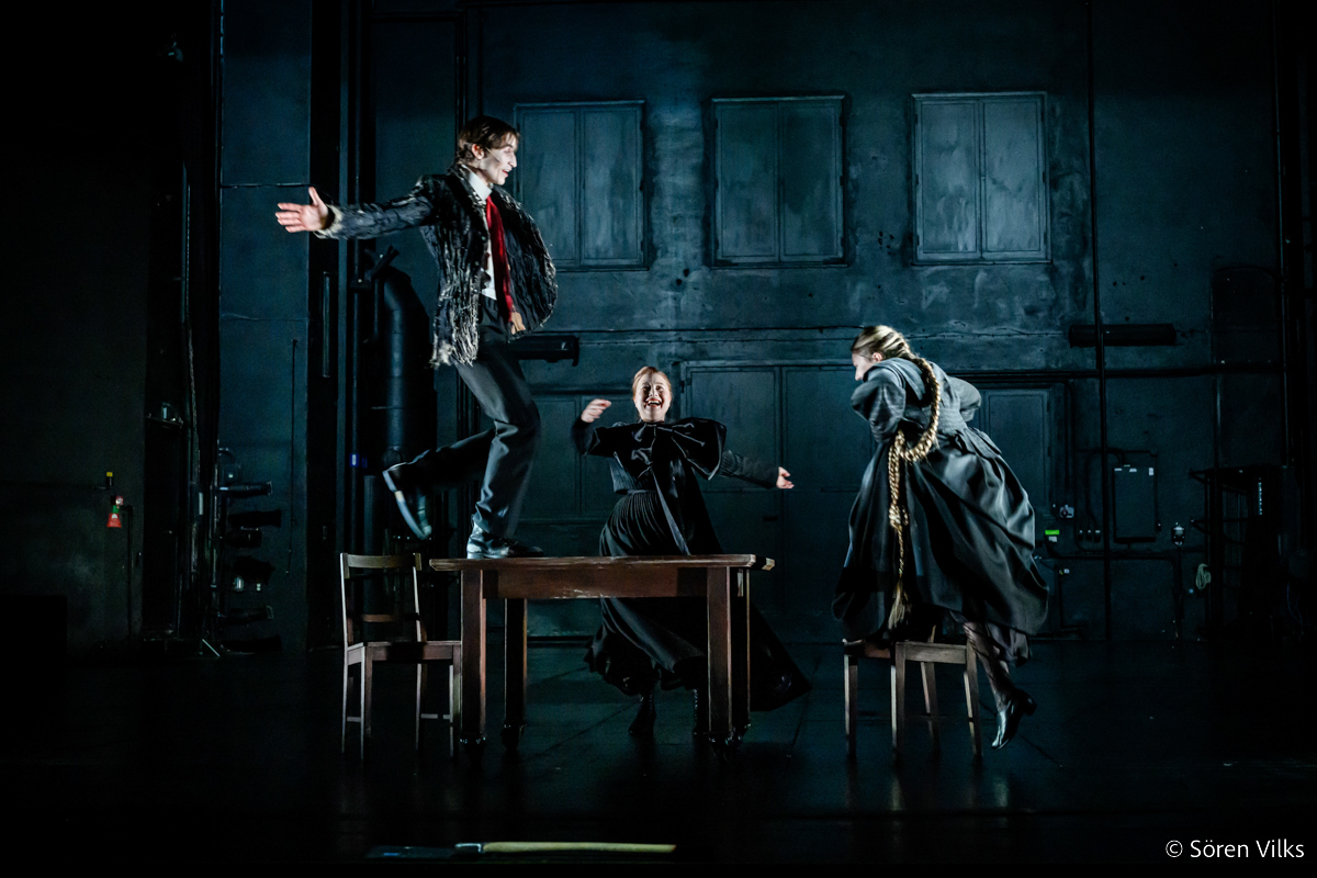 Gustav Lindh as Raskolnikov in a joyous reunion with Pulcheria and Dunya on stage in 'Crime and Punishment' at Dramaten Stockholm